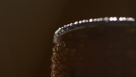 Close-Up-Backlit-Shot-Of-Condensation-Droplets-On-Revolving-Takeaway-Can-Of-Cold-Beer-Or-Soft-Drink-1